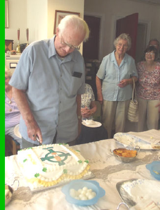 John Selway cutting cake